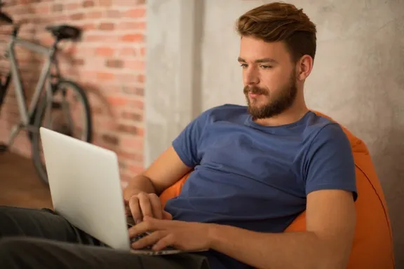 Men looking at laptop